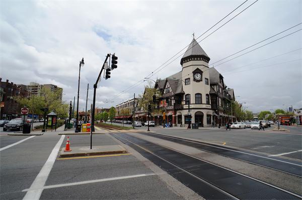 125 Pleasant Street, Unit 401 Brookline, MA 02446 - Photo 13 of 14 a view of a street with cars on the road