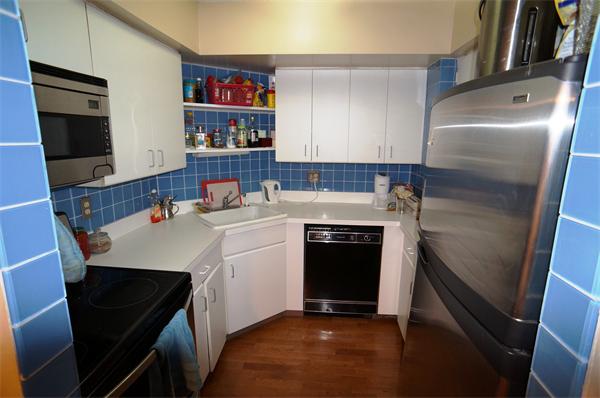 125 Pleasant Street, Unit 401 Brookline, MA 02446 - Photo 4 of 14 a utility room with washer and dryer