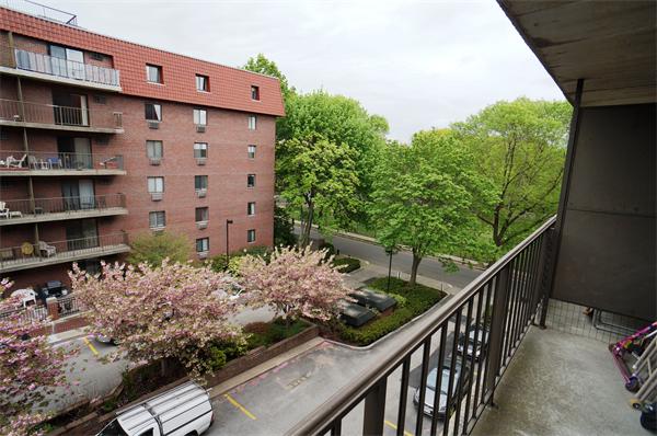 125 Pleasant Street, Unit 401 Brookline, MA 02446 - Photo 7 of 14 a view of a buildings from a balcony