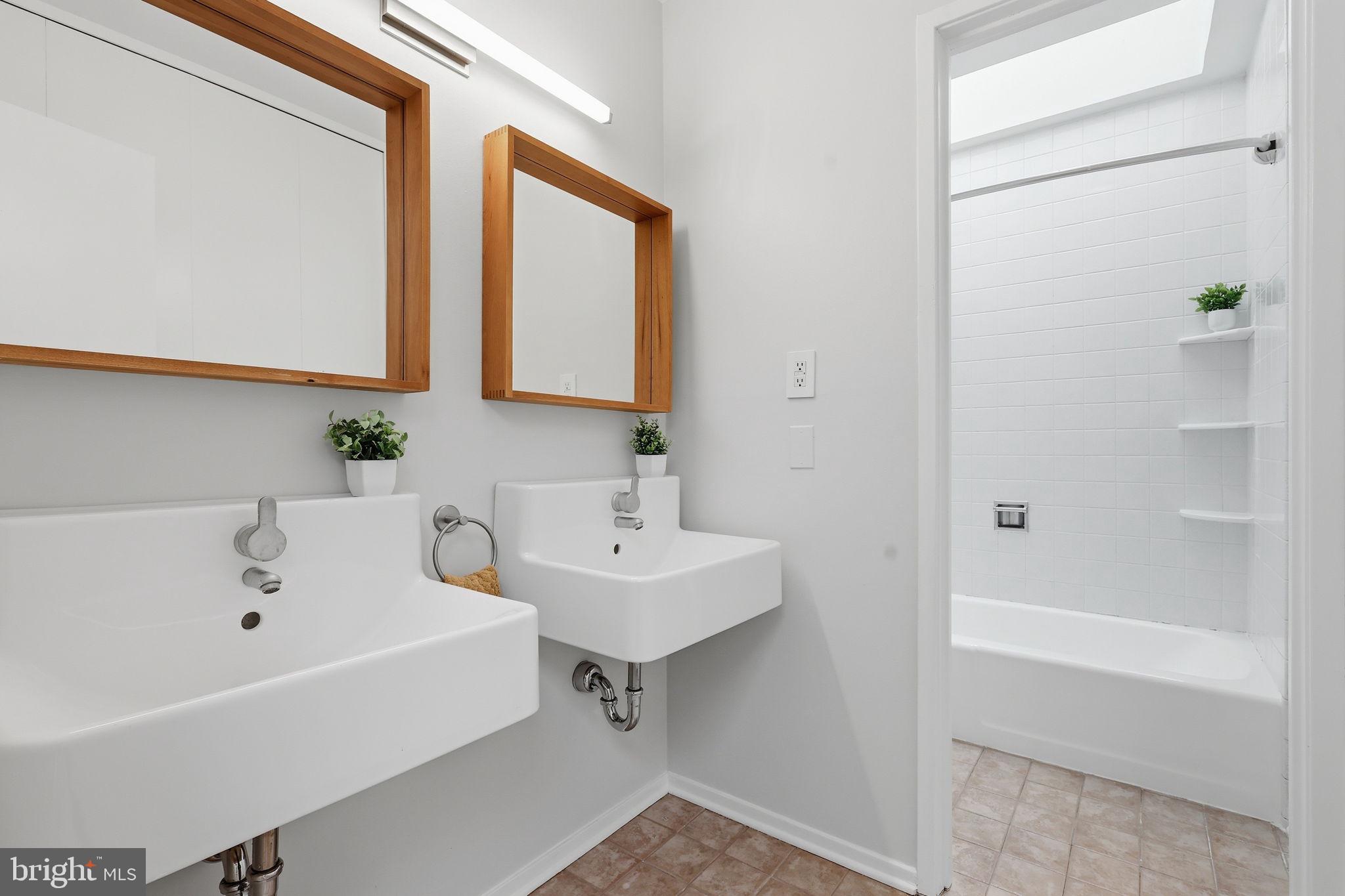 11510 Maple Ridge Road Reston, VA 20190 - Photo 30 of 43 a bathroom with a sink and a bathtub