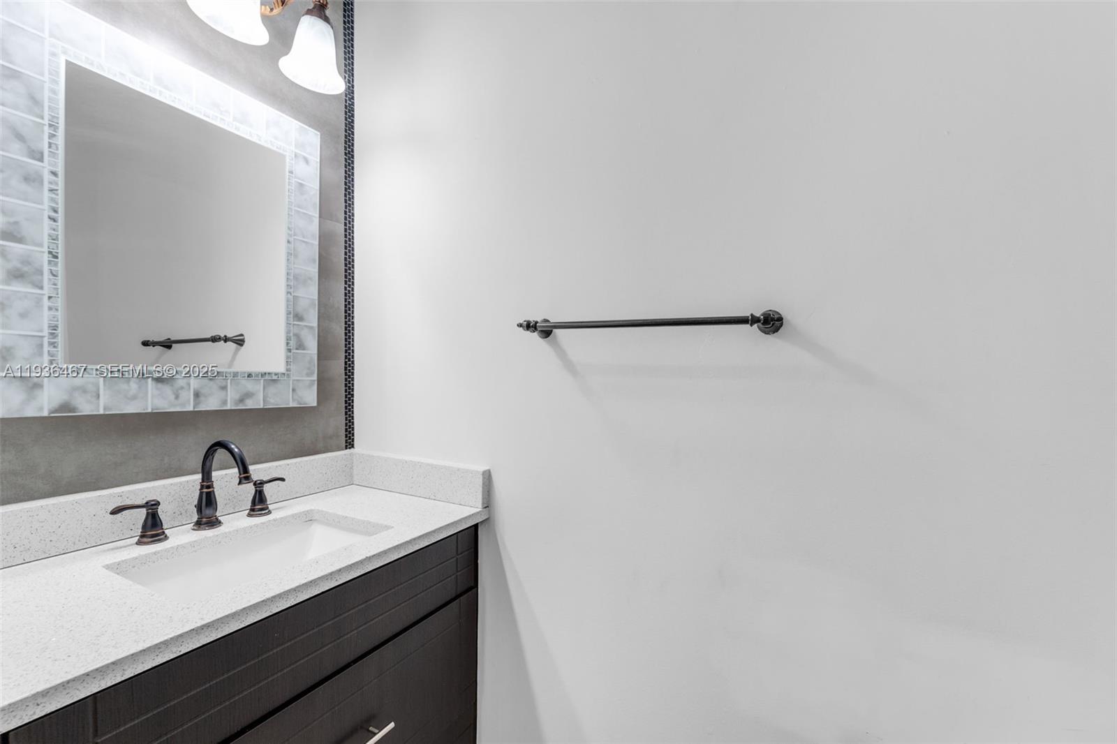 851 Southwest 154th Path, Unit 851 Miami, FL 33194 - Photo 12 of 45 a bathroom with a sink and a mirror