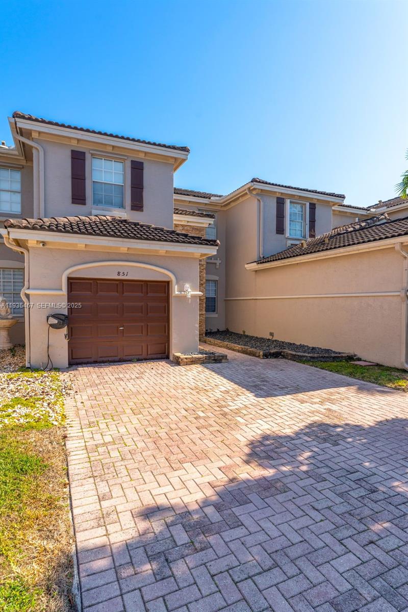 851 Southwest 154th Path, Unit 851 Miami, FL 33194 - Photo 22 of 45 a house view with a outdoor space