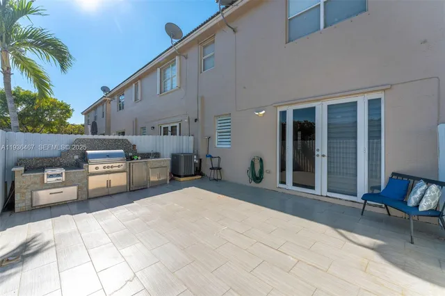 a bedroom with a bed and a night stand