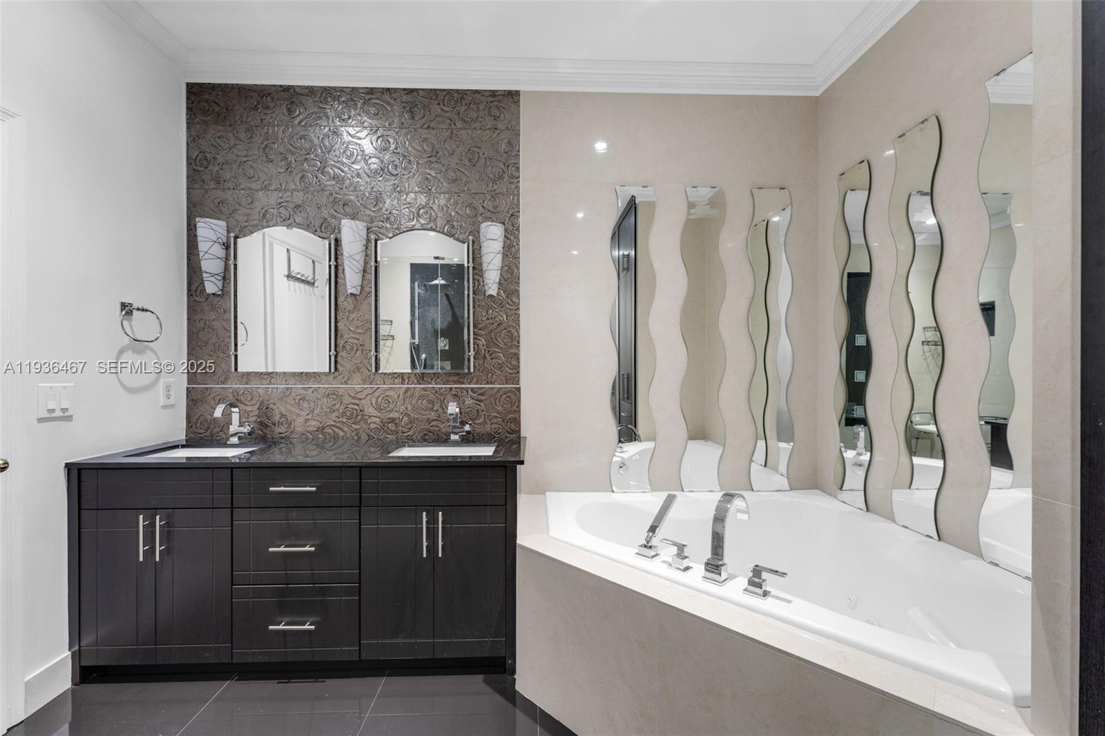 851 Southwest 154th Path, Unit 851 Miami, FL 33194 - Photo 6 of 45 a bathroom with a bathtub a double vanity sink and mirror