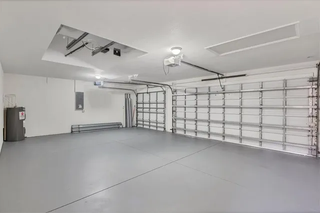 a view of a room with wooden floor and chandelier