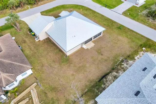 an aerial view of residential building with parking space