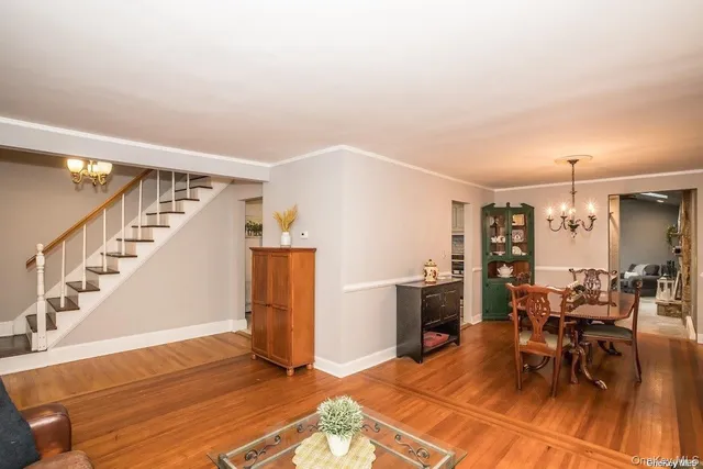 a view of a livingroom with furniture and a kitchen