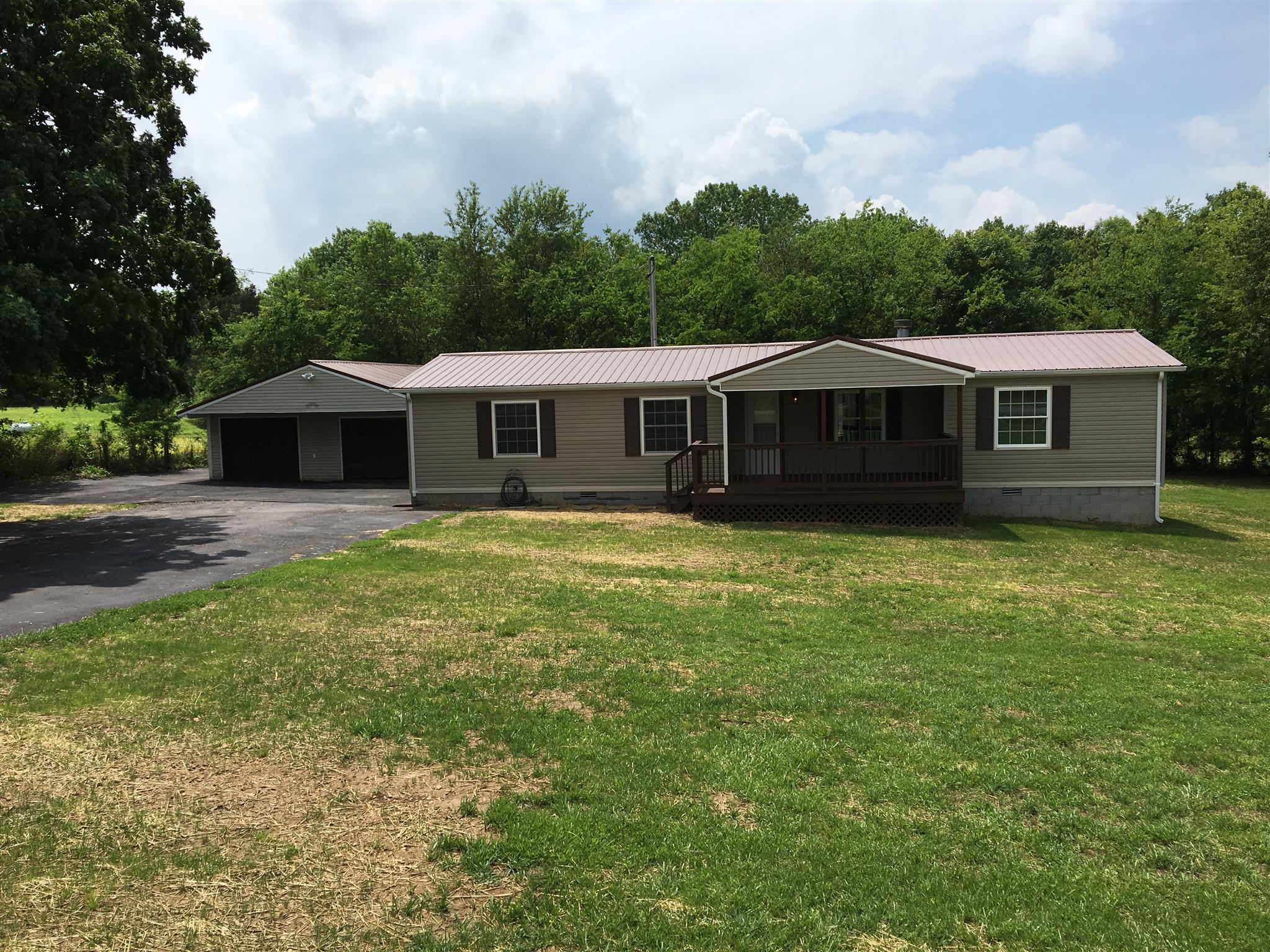 4302 Woodrow Wilson Road Springfield, TN 37172 - Photo 1 of 28 a front view of a house with garden