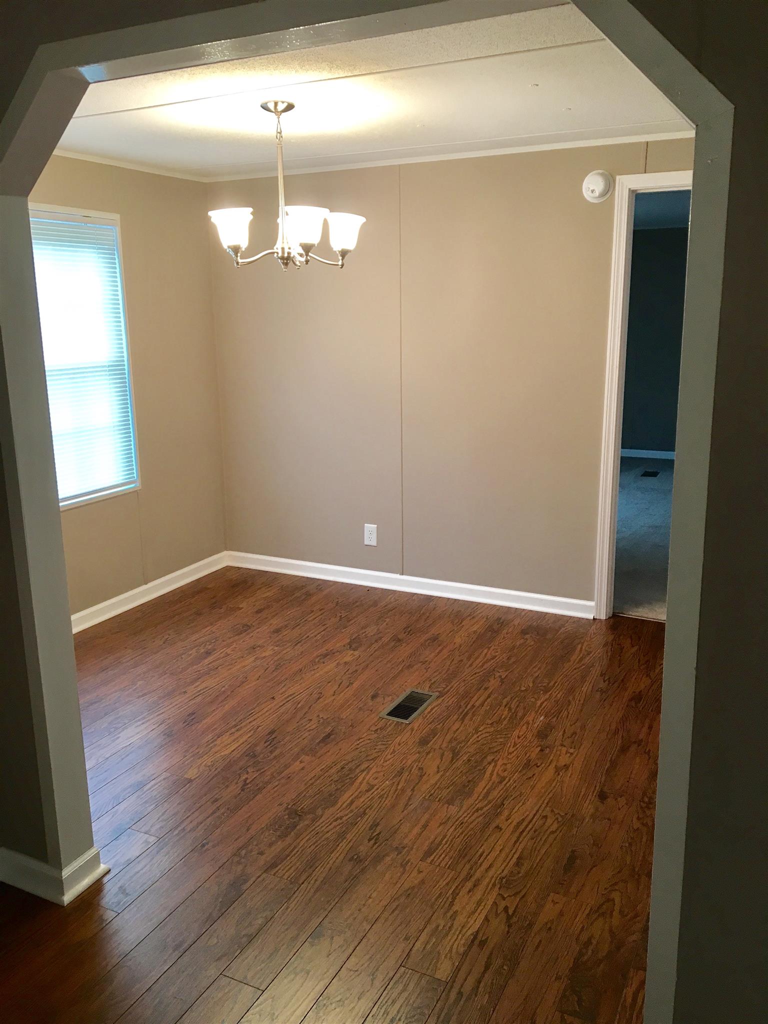 4302 Woodrow Wilson Road Springfield, TN 37172 - Photo 14 of 28 an empty room with wooden floor and windows