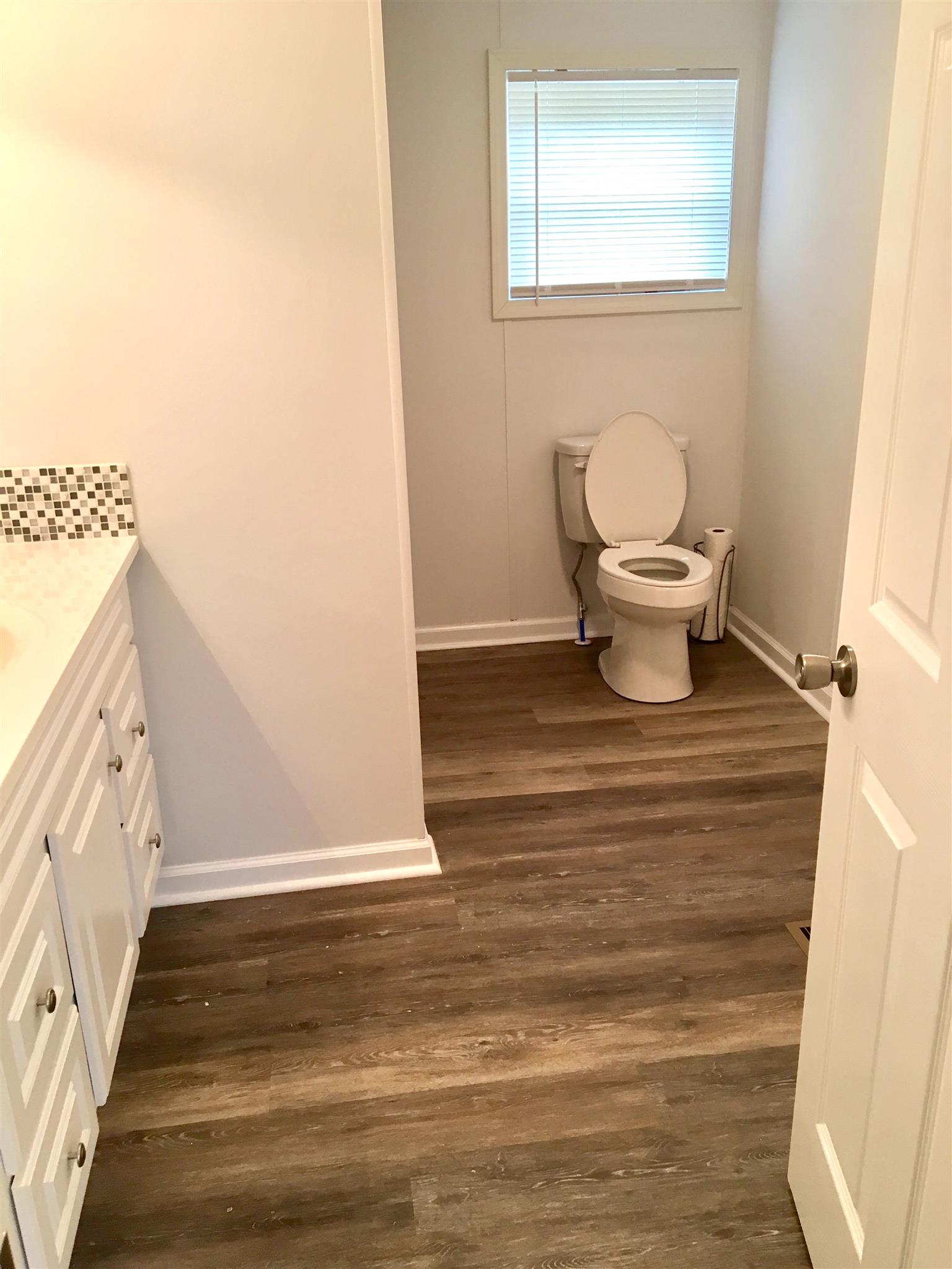 4302 Woodrow Wilson Road Springfield, TN 37172 - Photo 18 of 28 a bathroom with a toilet and a mirror