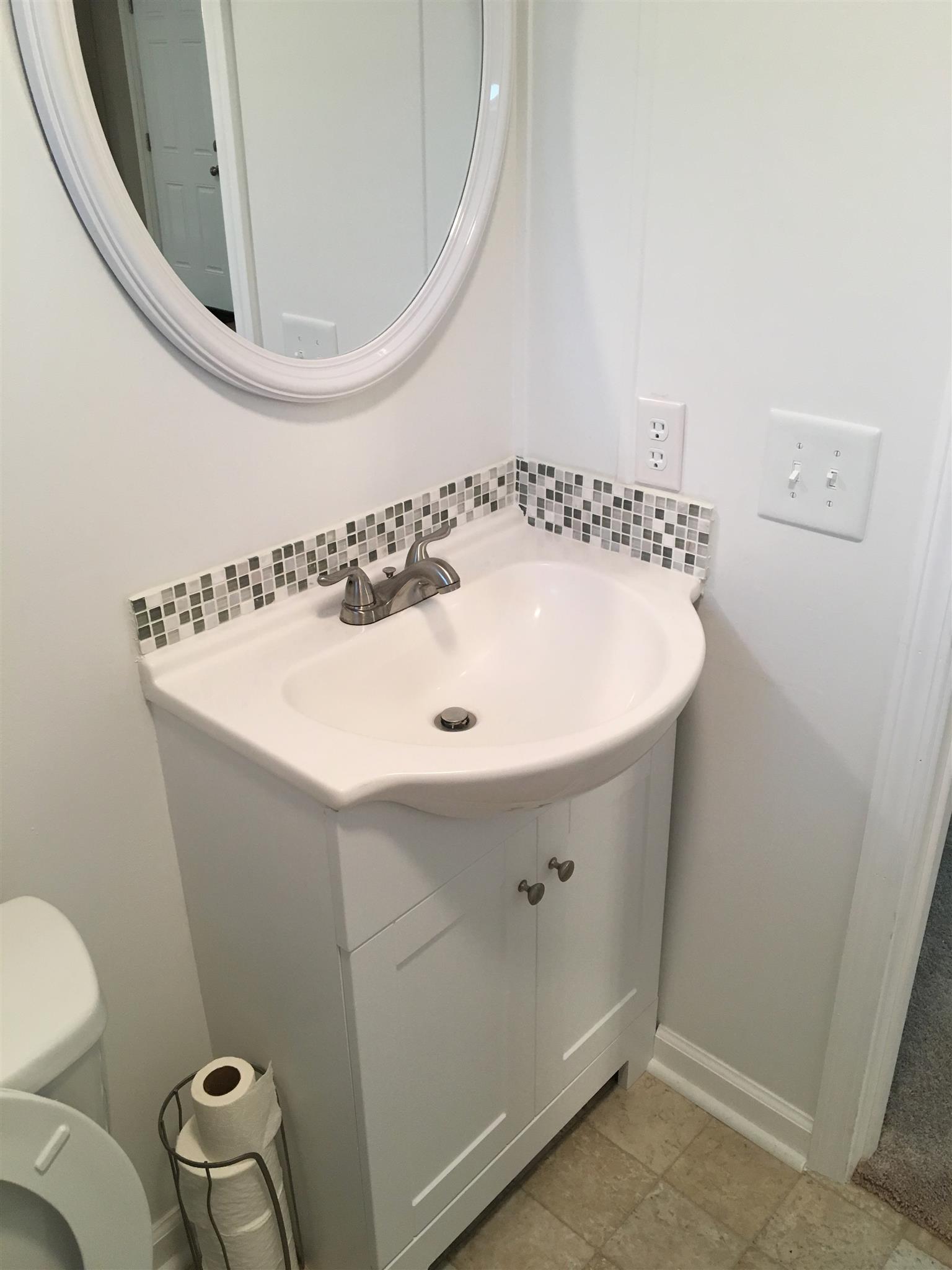 4302 Woodrow Wilson Road Springfield, TN 37172 - Photo 21 of 28 a bathroom with a sink and a mirror