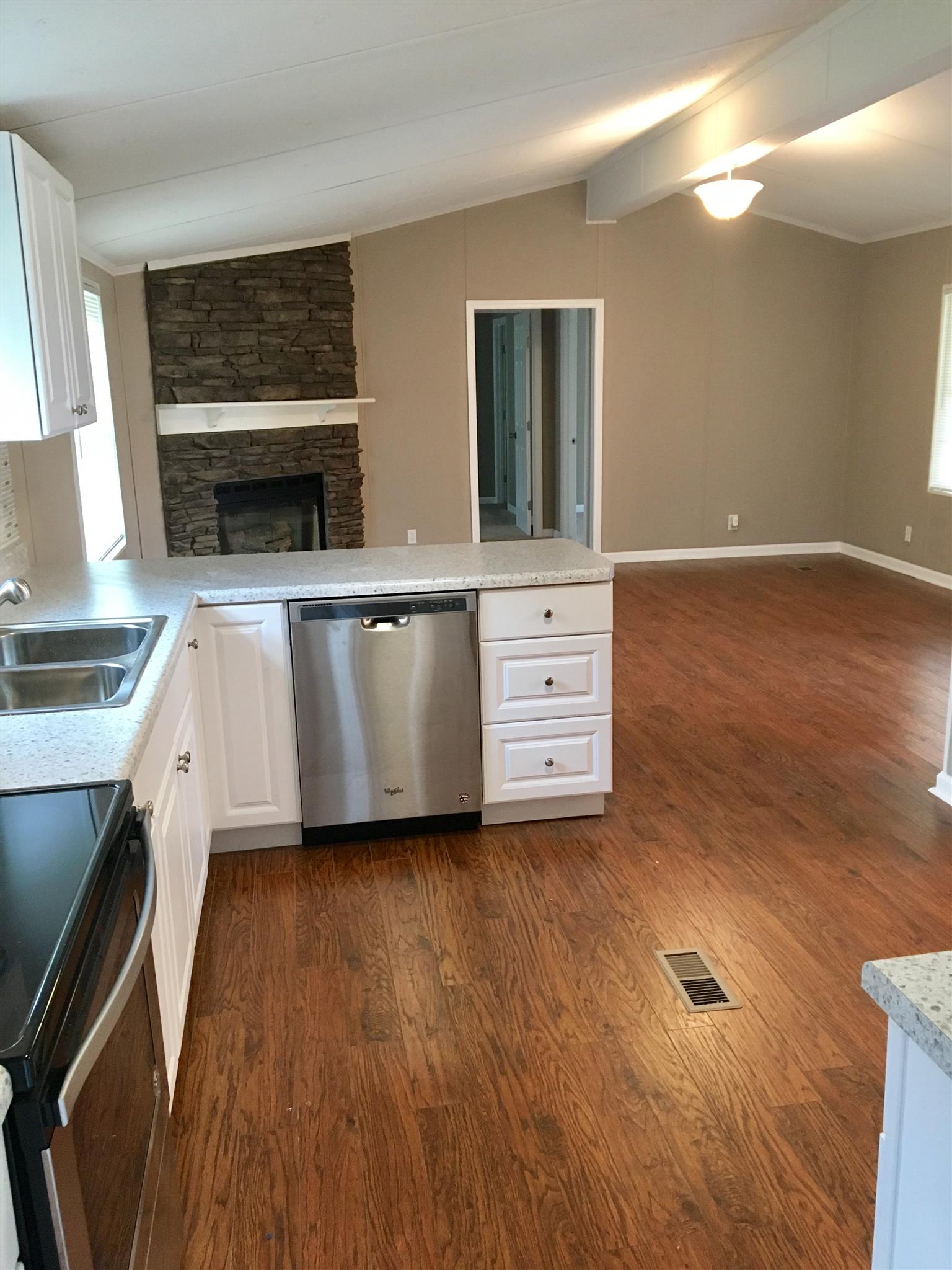 4302 Woodrow Wilson Road Springfield, TN 37172 - Photo 7 of 28 a kitchen with stainless steel appliances a stove a sink and a refrigerator