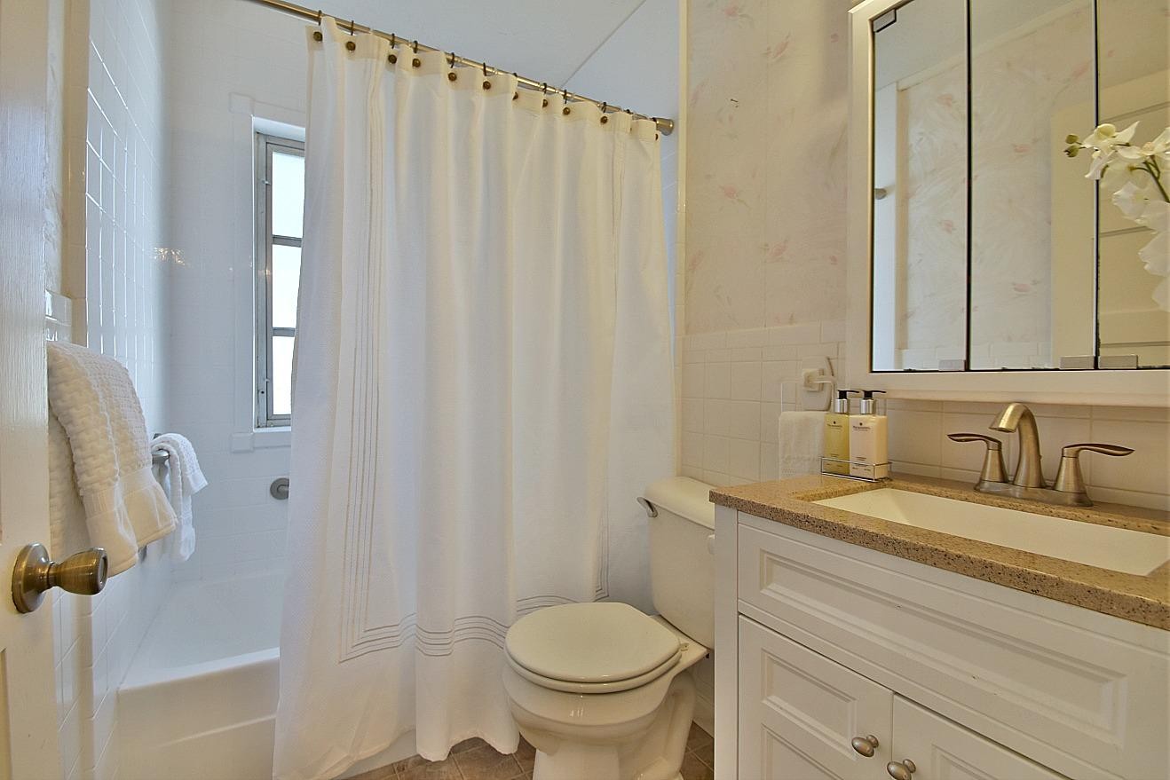 100 Orange Lane Oak Ridge, TN 37830 - Photo 13 of 19 a bathroom with a granite countertop sink toilet and a mirror