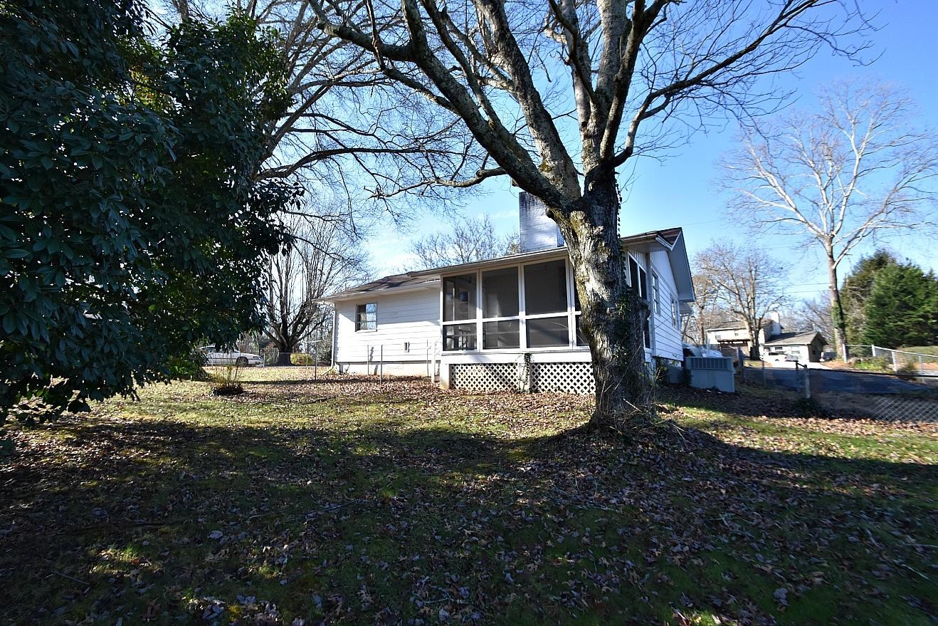 100 Orange Lane Oak Ridge, TN 37830 - Photo 19 of 19 a view of a house with backyard