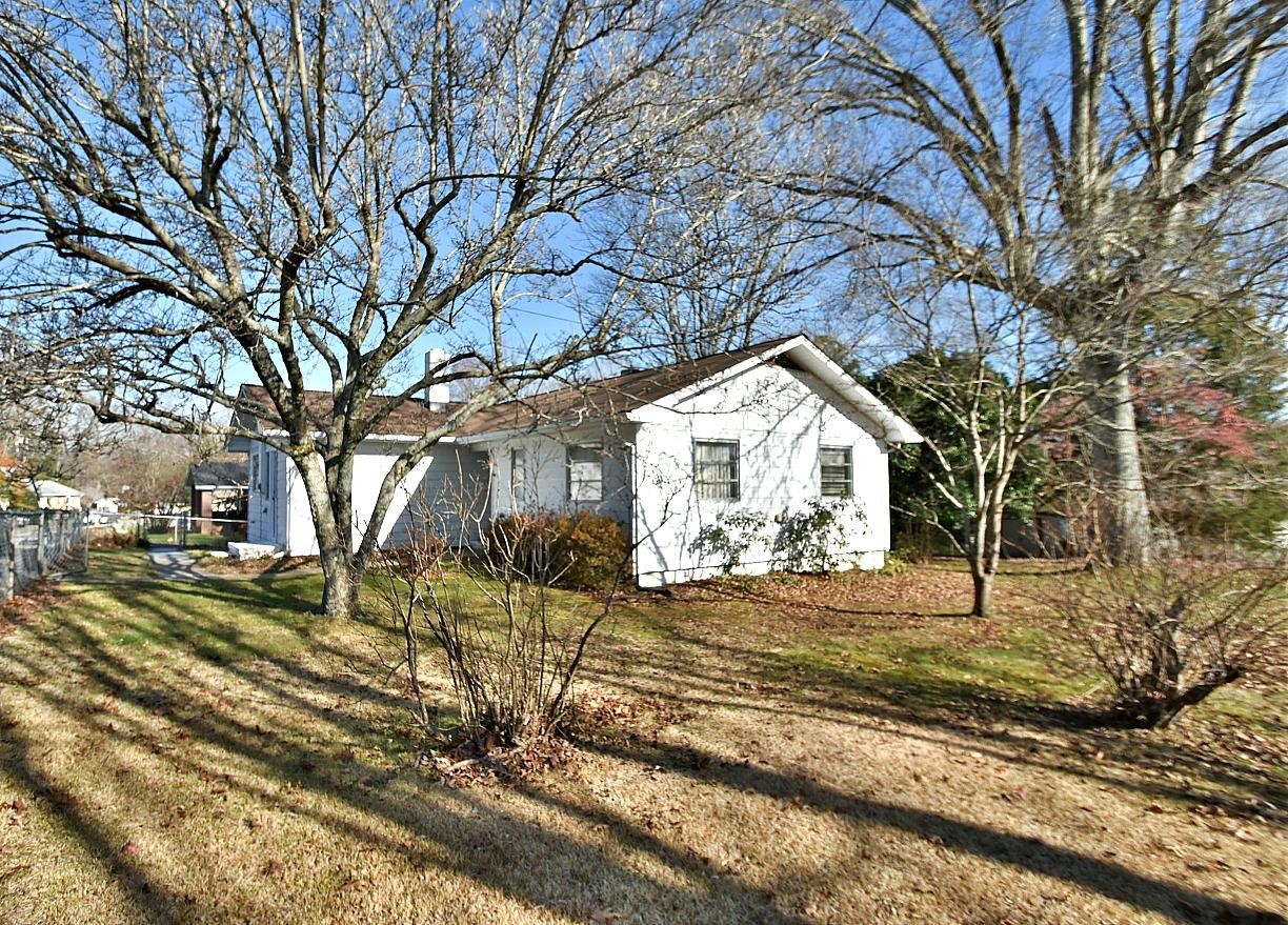 100 Orange Lane Oak Ridge, TN 37830 - Photo 2 of 19 a front view of a house with a yard