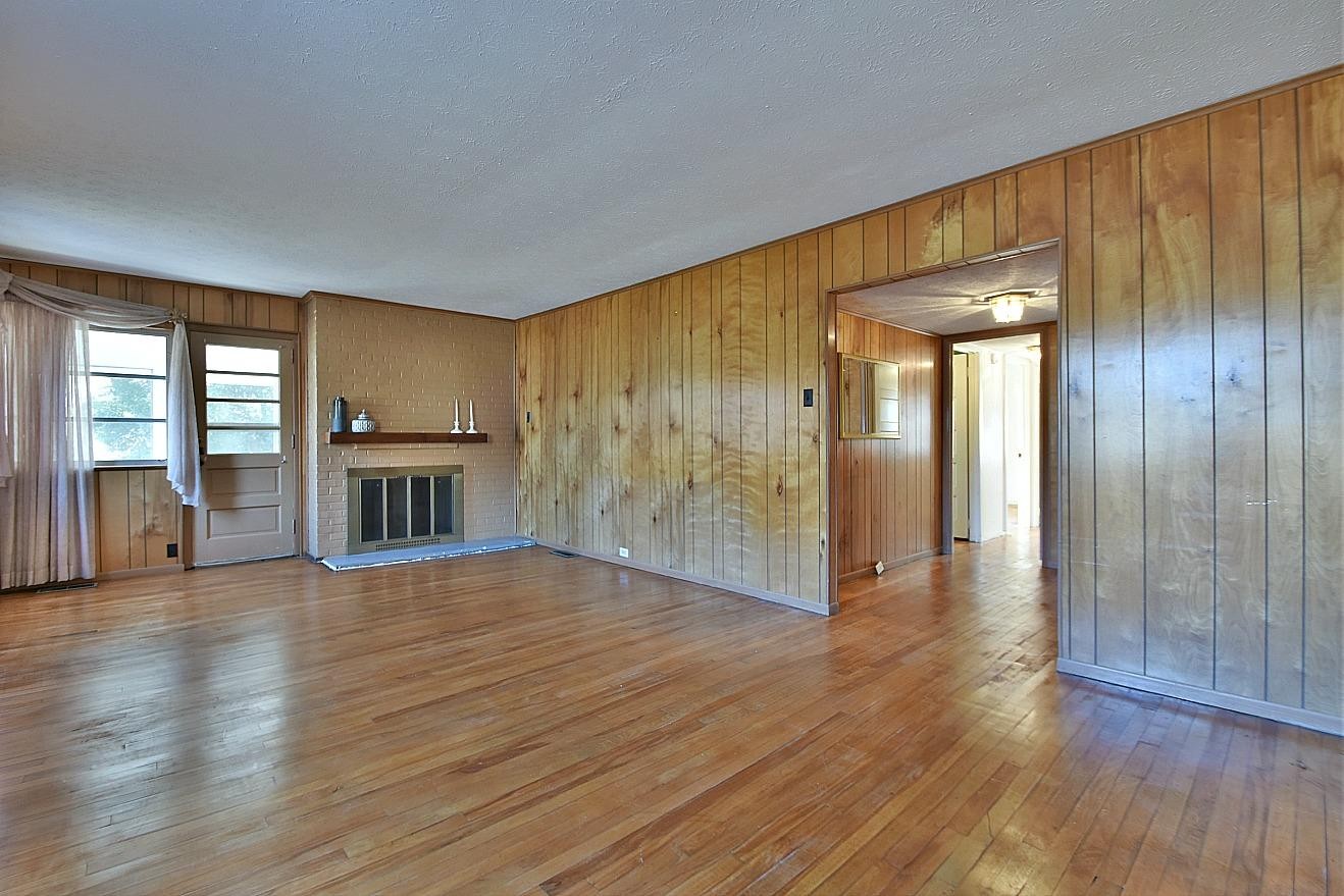 100 Orange Lane Oak Ridge, TN 37830 - Photo 4 of 19 a view of empty room with wooden floor and fireplace