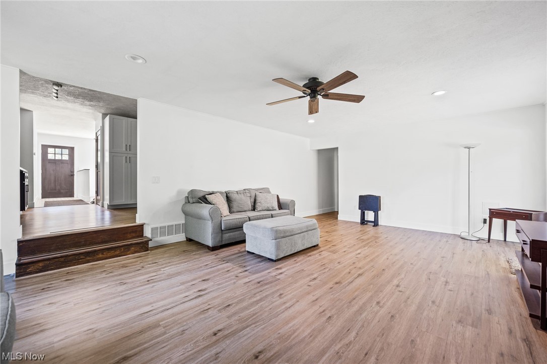 38484 Otten Road North Ridgeville, OH 44039 - Photo 12 of 32 Hardwood floored living room with ceiling fan