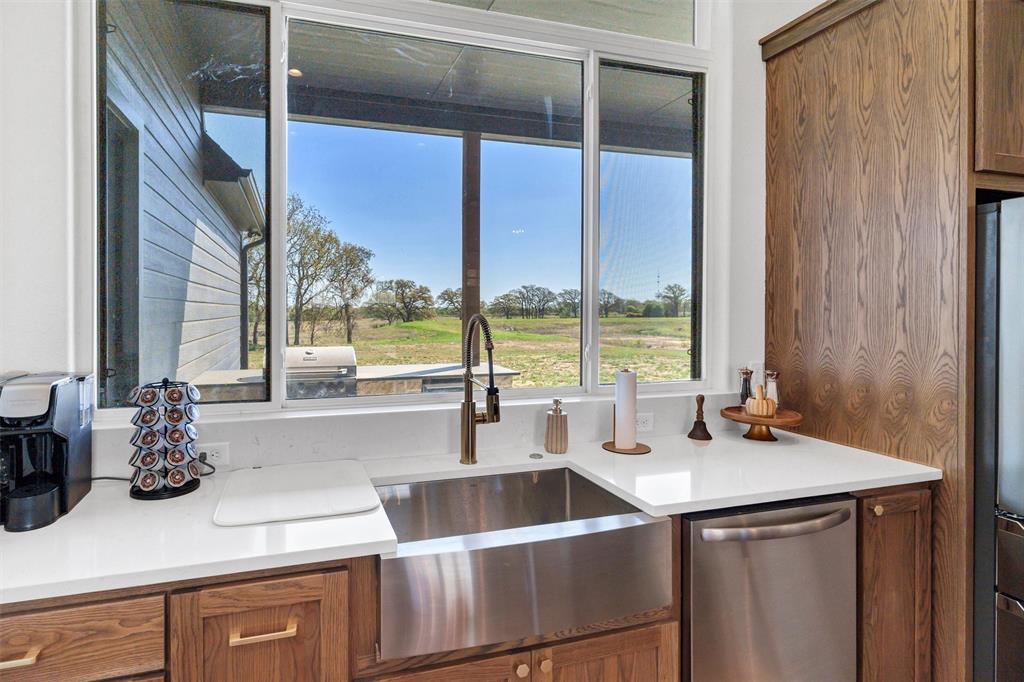 2105 Rattler Way Tolar, TX 76476 - Photo 13 of 30 a kitchen with a sink and a window
