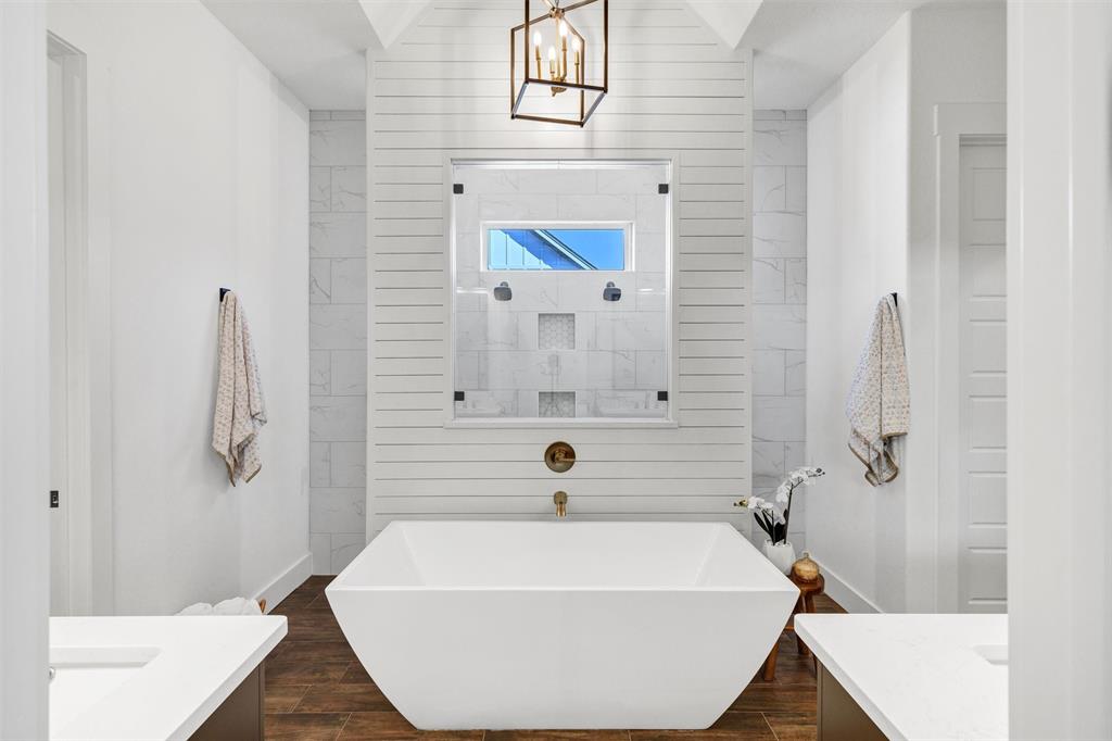 2105 Rattler Way Tolar, TX 76476 - Photo 21 of 30 a bathroom with a tub and a shower