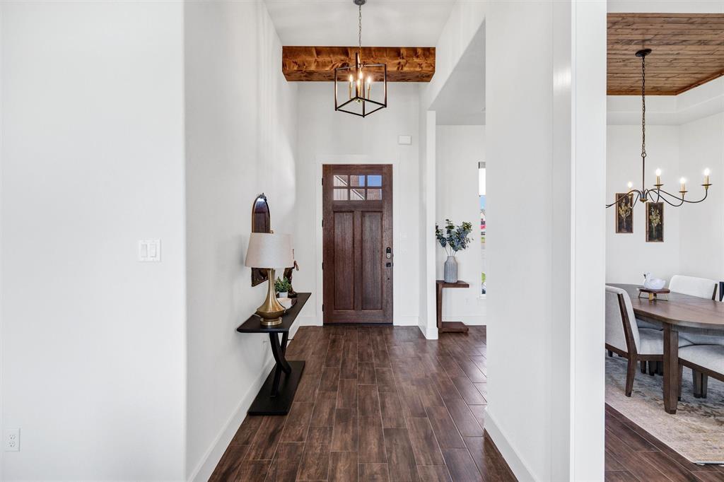 2105 Rattler Way Tolar, TX 76476 - Photo 5 of 30 a view of a hallway with wooden floor and workspace