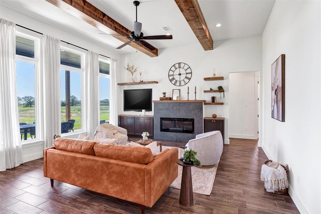 2105 Rattler Way Tolar, TX 76476 - Photo 6 of 30 a living room with furniture fireplace and flat screen tv
