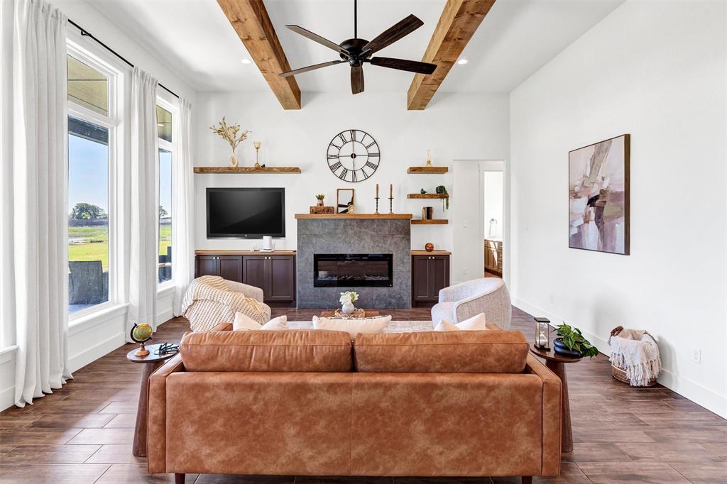 2105 Rattler Way Tolar, TX 76476 - Photo 7 of 30 a living room with furniture and a fireplace