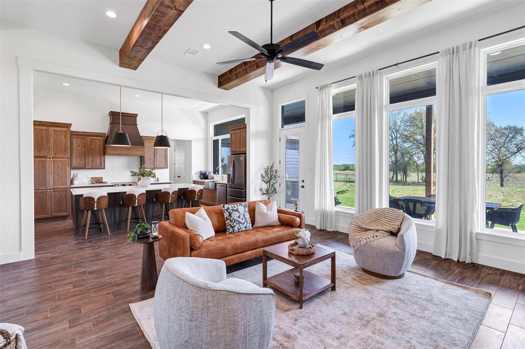 2105 Rattler Way Tolar, TX 76476 - Photo 8 of 30 a living room with furniture kitchen view and a large window