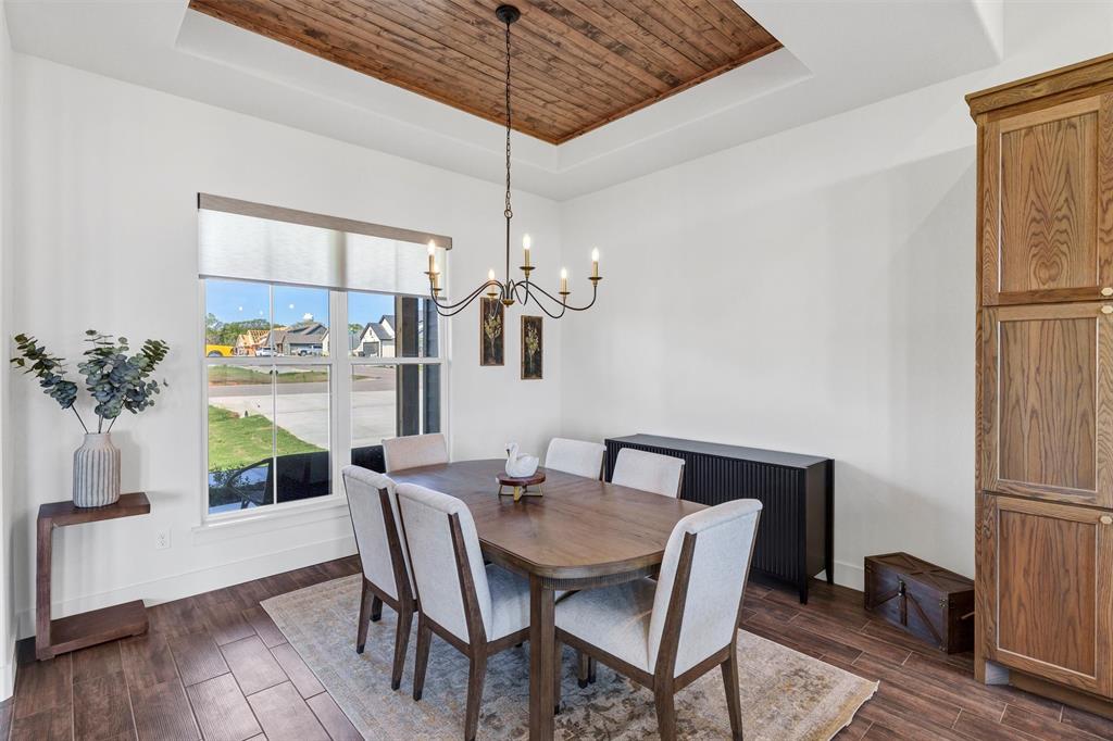 2105 Rattler Way Tolar, TX 76476 - Photo 10 of 30 a view of a dining room with furniture window and wooden floor