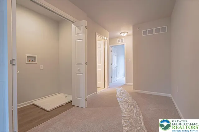 a bedroom with a bed and a table