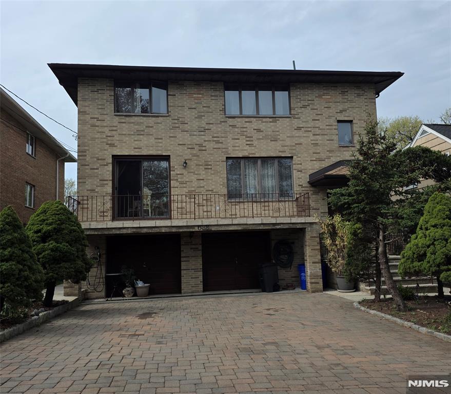 688 Day Avenue, Unit 2 Ridgefield, NJ 07657 - Photo 1 of 18 a front view of a house with yard