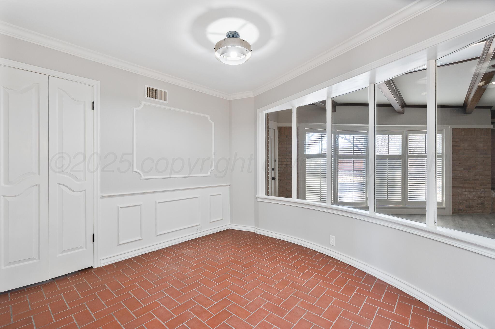207 Yucca Terrace Plainview, TX 79072 - Photo 14 of 50 a view of an empty room with a window