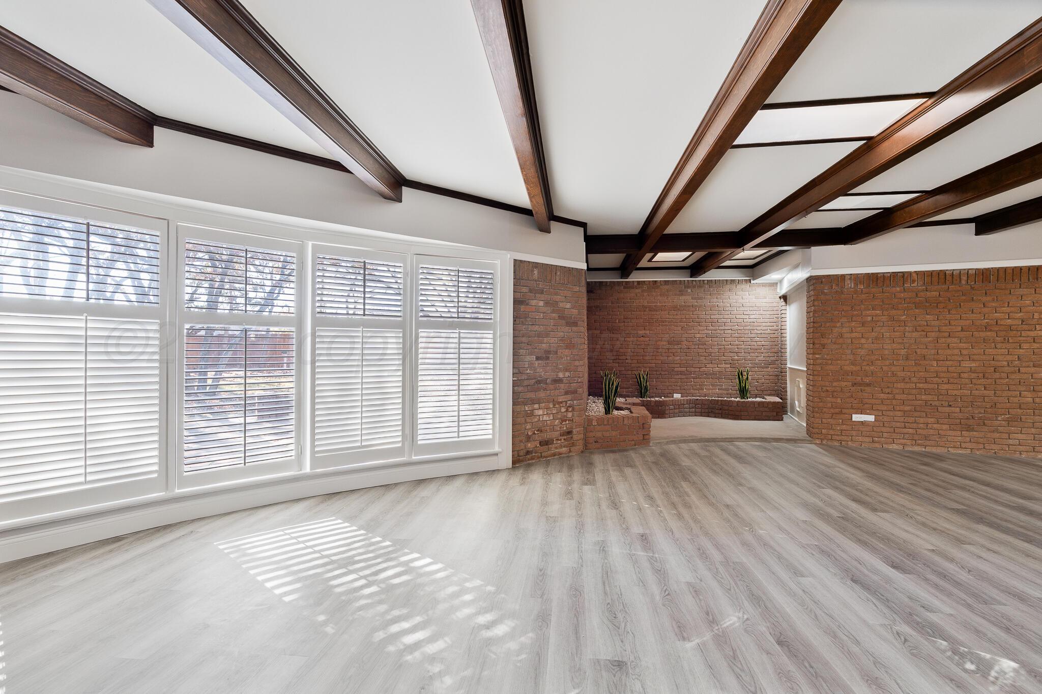 207 Yucca Terrace Plainview, TX 79072 - Photo 19 of 50 a view of an empty room with a window