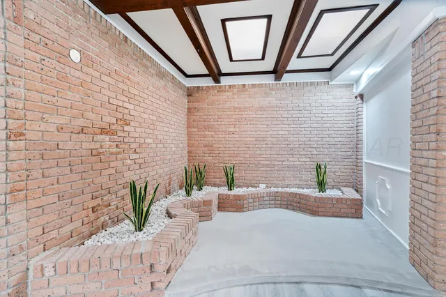 a view of an empty room with a cabinet