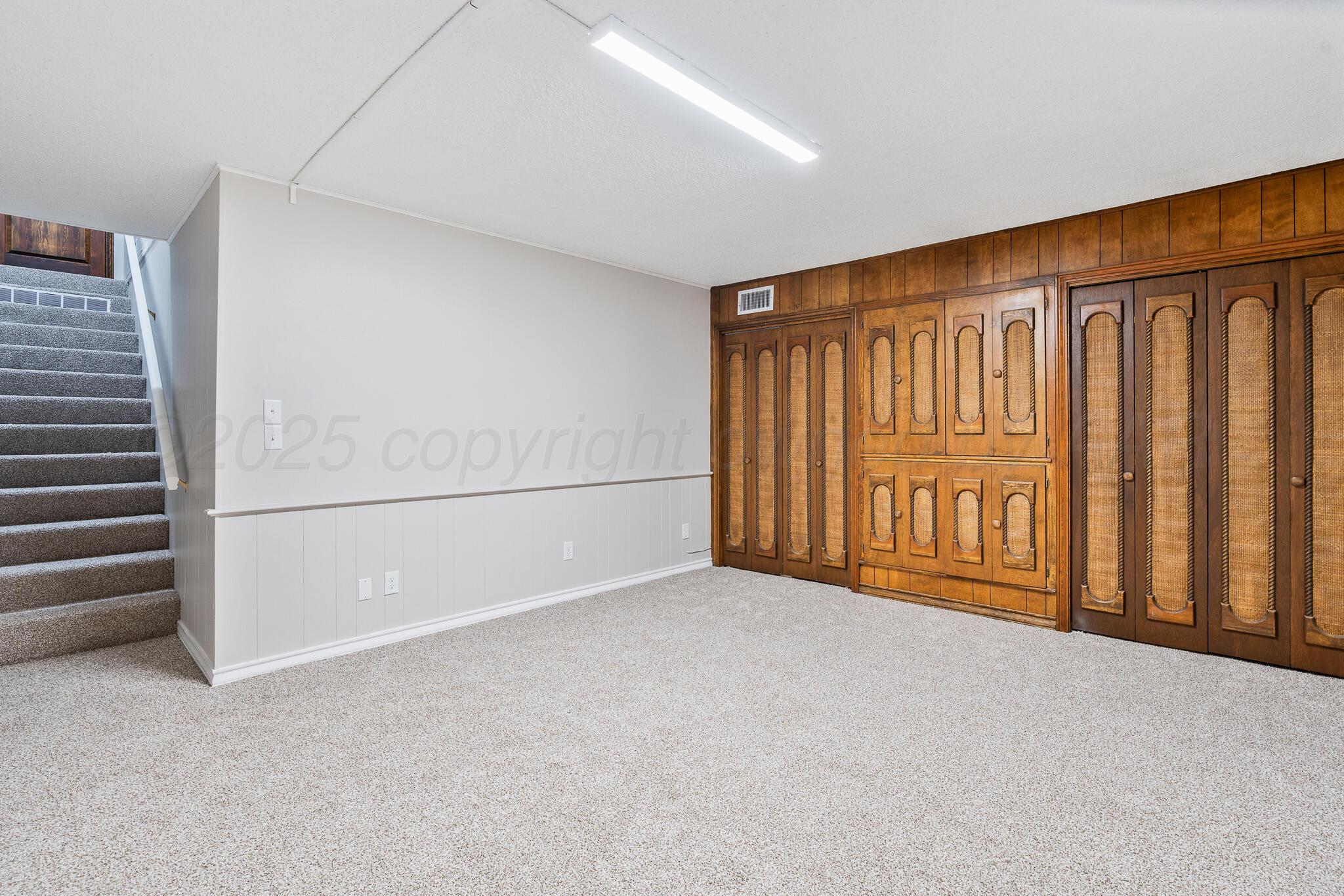 207 Yucca Terrace Plainview, TX 79072 - Photo 26 of 50 a view of an empty room with a window