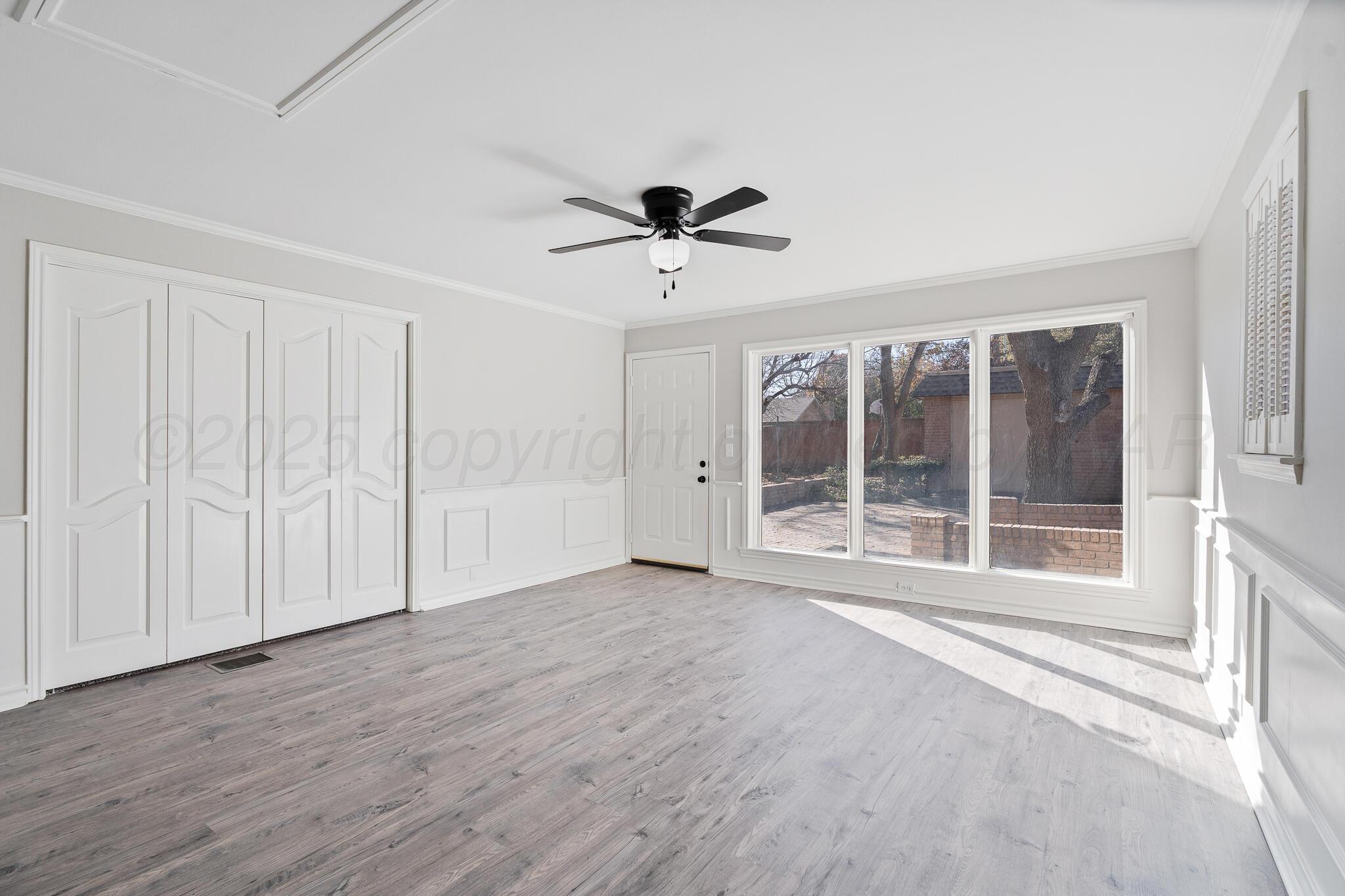 207 Yucca Terrace Plainview, TX 79072 - Photo 28 of 50 a view of an empty room with a window
