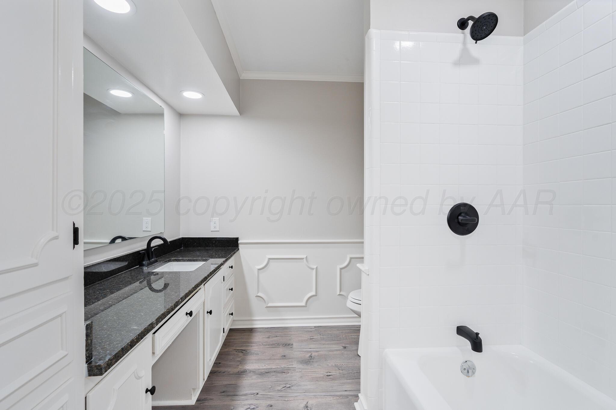 207 Yucca Terrace Plainview, TX 79072 - Photo 32 of 50 a bathroom with a granite countertop sink