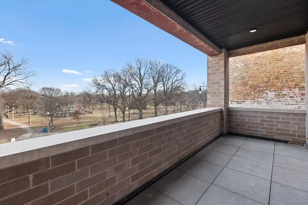 a view of a balcony with an outdoor space