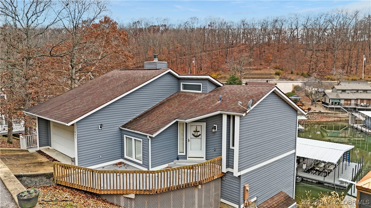 603 Niangua Shores Road Camdenton, MO 65020 - Photo 6 of 43 Side view of home from street (old roof)