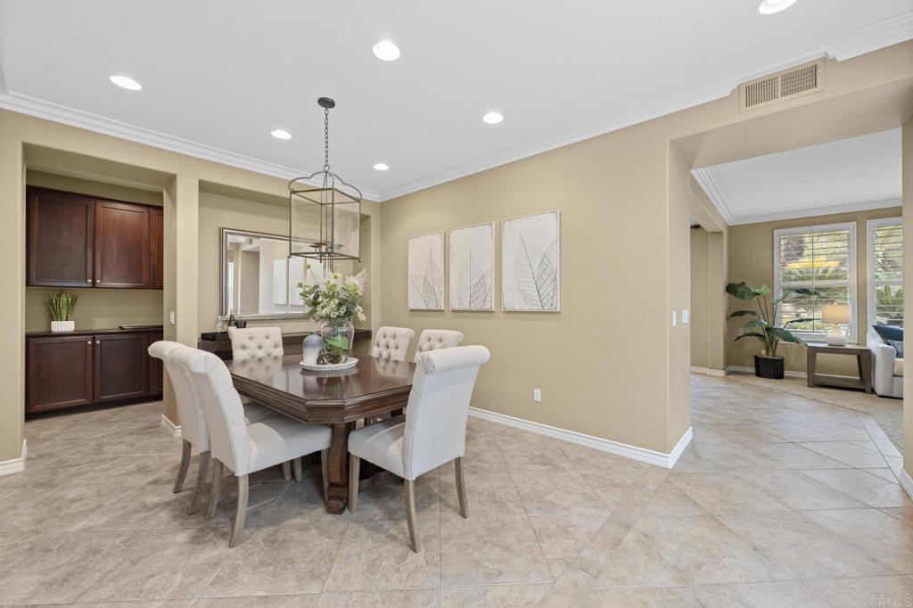8021 Paseo Arrayan Carlsbad, CA 92009 - Photo 13 of 68 a view of a dining room with furniture