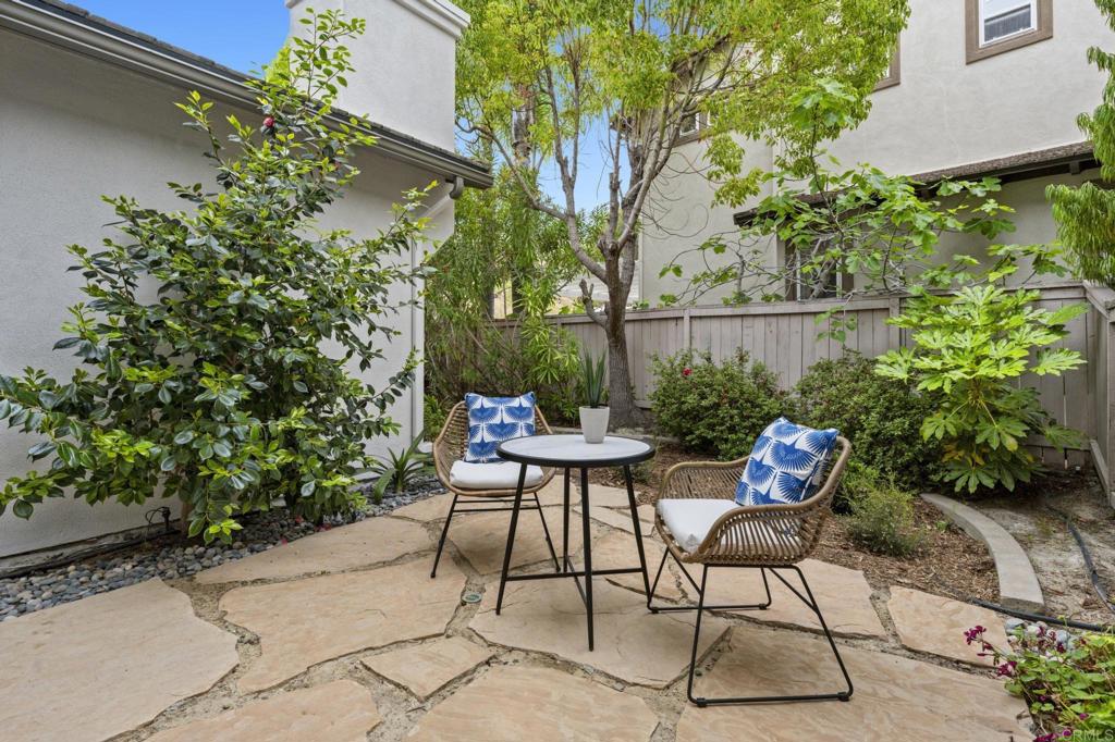 8021 Paseo Arrayan Carlsbad, CA 92009 - Photo 15 of 68 a view of chair and tables in the backyard