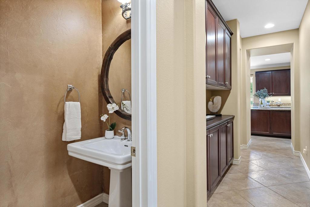 8021 Paseo Arrayan Carlsbad, CA 92009 - Photo 17 of 68 a bathroom with a sink and a mirror