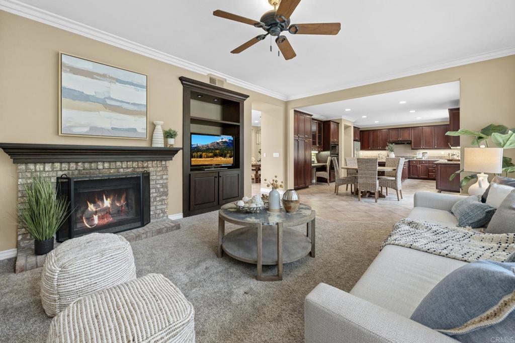 8021 Paseo Arrayan Carlsbad, CA 92009 - Photo 21 of 68 a living room with furniture and a fireplace