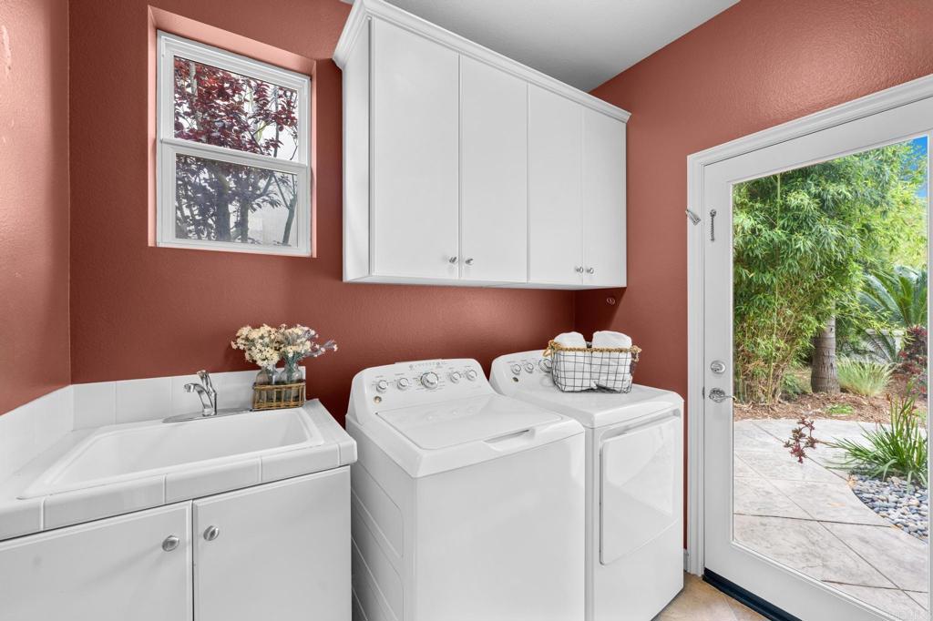 8021 Paseo Arrayan Carlsbad, CA 92009 - Photo 30 of 68 a utility room with dryer and washer