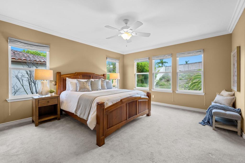 8021 Paseo Arrayan Carlsbad, CA 92009 - Photo 3 of 68 a spacious bedroom with a bed and a couch