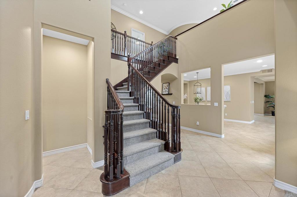 8021 Paseo Arrayan Carlsbad, CA 92009 - Photo 31 of 68 a view of a hallway with a door and stairs