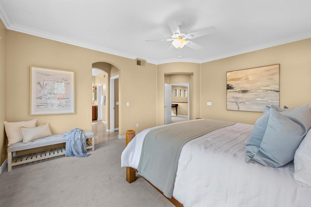 8021 Paseo Arrayan Carlsbad, CA 92009 - Photo 37 of 68 a spacious bedroom with a bed and a couch