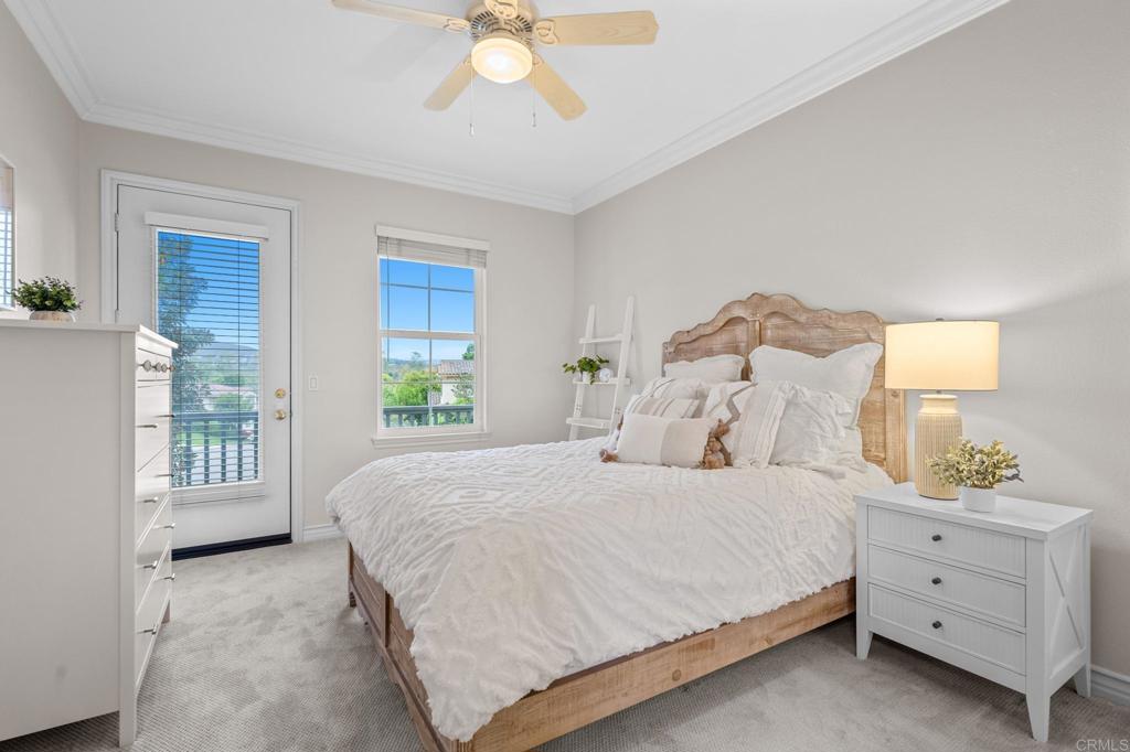 8021 Paseo Arrayan Carlsbad, CA 92009 - Photo 47 of 68 a bedroom with a bed and a window