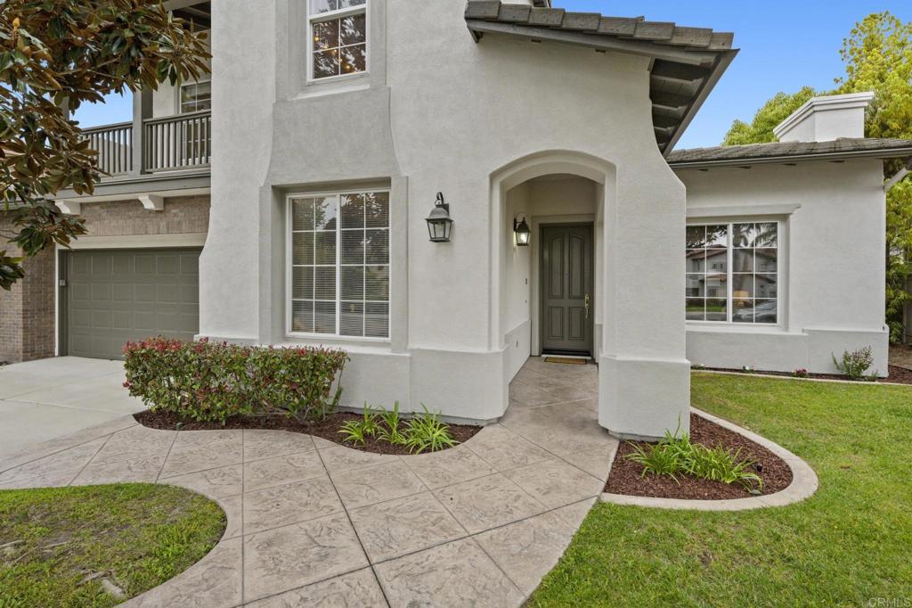8021 Paseo Arrayan Carlsbad, CA 92009 - Photo 7 of 68 a front view of a house with garden