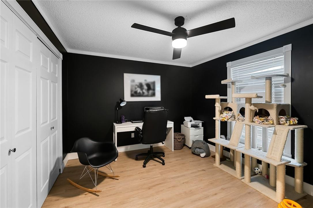 9085 Southwest 20th Street, Unit D Boca Raton, FL 33428 - Photo 18 of 25 a view of a livingroom with workspace and a window