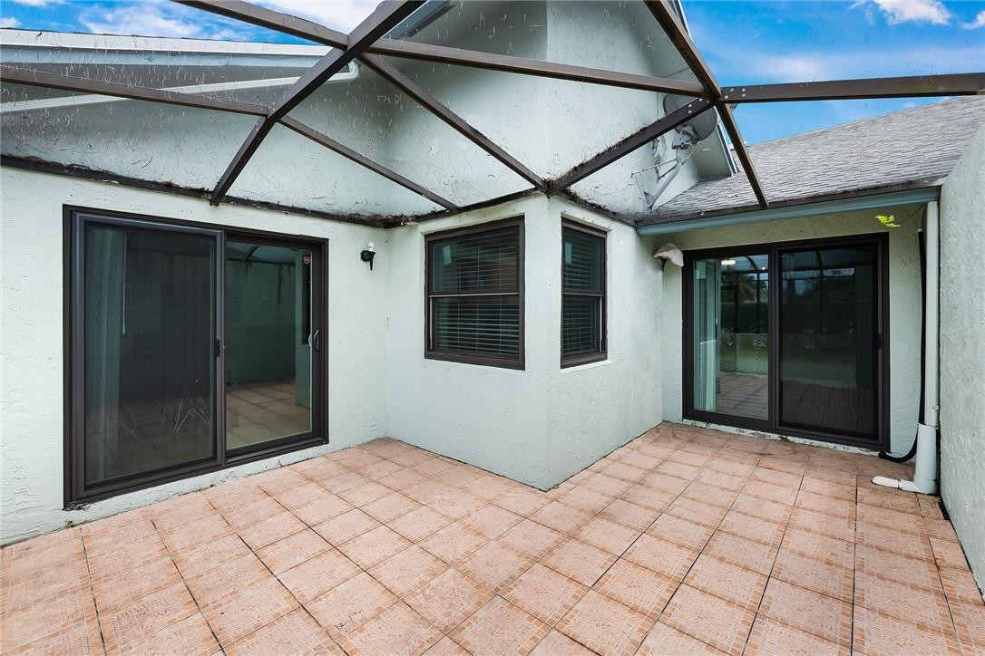 9085 Southwest 20th Street, Unit D Boca Raton, FL 33428 - Photo 19 of 25 a bedroom with a bed and a window